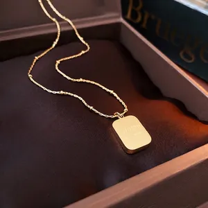 Titanium steel square charm necklace with gold bead chain in a velvet jewelry box