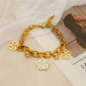 Bracelet double chaîne en acier inoxydable doré avec breloques fleurs et cristaux brillants