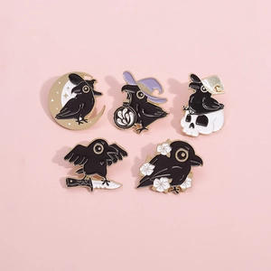 5pcs cartoon black crow enamel pins set with moon and skull motifs on pink background