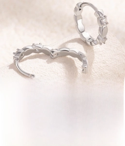 Detail of silver huggie earring with zircons and 10mm inner diameter copper base