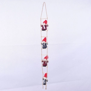 Detail of wool felt gnomes climbing on a wooden hemp rope ladder for Christmas decor