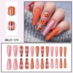 Halloween long ballerina press-on nails with orange glitter and pumpkin lantern designs