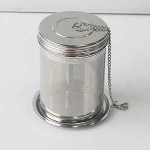Detailed macro view of SUS 304 stainless steel tea infuser with fine mesh and drip tray