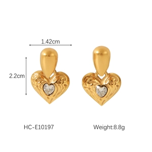 Detailed view of gold heart earrings with zircon inlay including size 1.42cm x 2.2cm