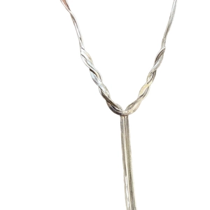 Silver multi-layer snake chain necklace with long fringe pendant in a minimalist style