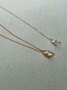 Minimalist 925 silver key lock necklace with white mother of pearl inlay in gold and silver