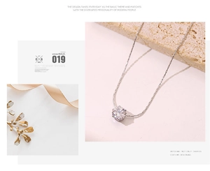 Macro detail of minimalist silver necklace featuring a brilliant round-cut solitaire diamond