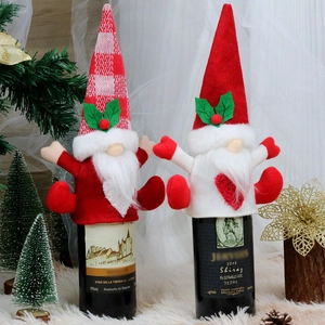 Christmas faceless gnome wine bottle covers with red knit patterns and holly leaf details