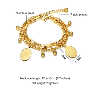 Detail view of gold-plated stainless steel layered bracelet with Virgin Mary pendants