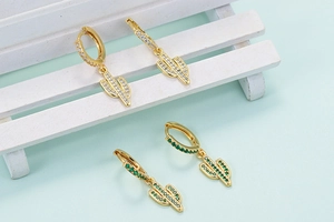 Exaggerated cactus hoop earrings with green and white zircons in gold plating finish