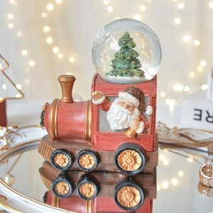 Vintage train musical snow globe with Santa Claus relief and sparkling sequins inside