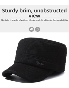 Detail of black wool flat top cap with sport metal badge and ear protection texture