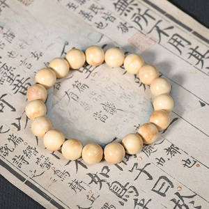 Authentic milky white wood bead bracelet with fine grain on vintage calligraphy paper
