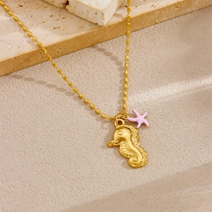 Gold stainless steel necklace featuring seahorse pendant and pink starfish charm