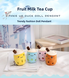 Close-up of assorted plush bubble tea keychains with fruit designs and cute expressions