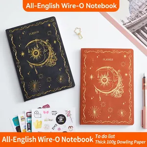 Undated weekly planners with gold-stamped sun and moon sun design on faux leather covers