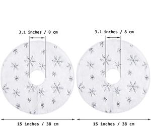 Detail showing 38cm white plush mini Christmas tree skirt with silver snowflake pattern