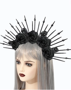 Macro detail of gothic headband with black roses, mini skulls and sunburst spikes