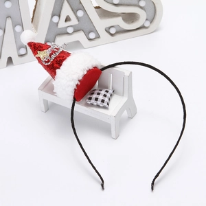 Detail view of red sequin Christmas hat headband with white fur trim and gold star decor