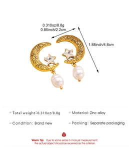 Detail view of crescent moon and star pearl drop earrings with 4.8x2.2cm size specs
