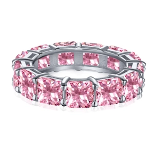 Eternity ring with pink princess cut stones set in S925 sterling silver on white background