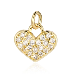 Macro detail of gold-plated heart pendant with cubic zirconia for jewelry making