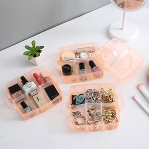 Three-tier pink transparent plastic organizer boxes for jewelry and cosmetics storage