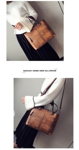 Detail view of retro brown oil leather tote bag showing double pockets and large capacity