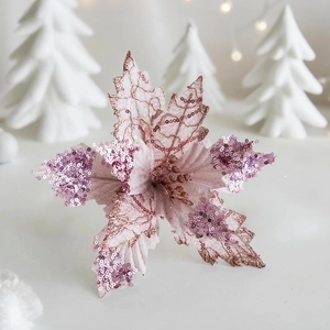Close-up of artificial velvet poinsettia flower with pink sequins for Christmas tree decor