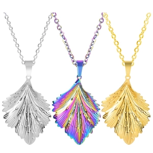 Three leaf pendants in gold, silver, and iridescent finishes with detailed vein textures