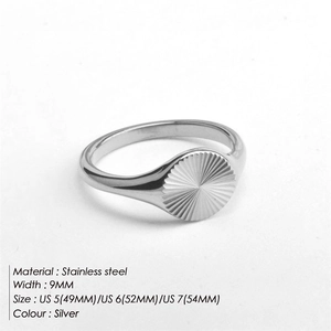 Macro view of a 9mm stainless steel ring with radial sunburst texture and silver finish