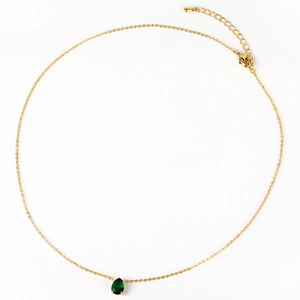 Close-up of 18K gold chain with pear-shaped emerald zircon pendant and lobster clasp