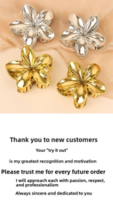 Detailed view of four metallic flower hair claws in polished gold and silver finishes