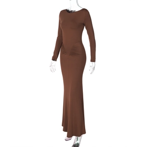 Detail view of brown slim fit long sleeve dress showing waist ruching and fabric texture