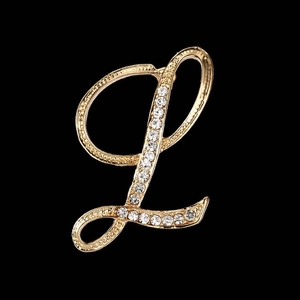 Elegant gold letter L brooch with sparkling crystal rhinestones on black background