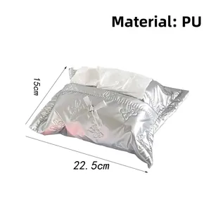 Detail view of silver PU tissue box with bow embossed pattern and 22.5x15cm dimensions