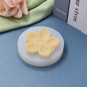 Flower shaped silicone mold for DIY baking with detailed cherry blossom texture