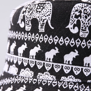 Close-up of elephant and geometric prints on textured canvas bucket hat fabric