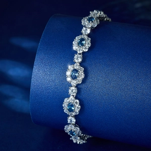 Elegant S925 sterling silver bracelet with sparkling blue and white zircon flower charms