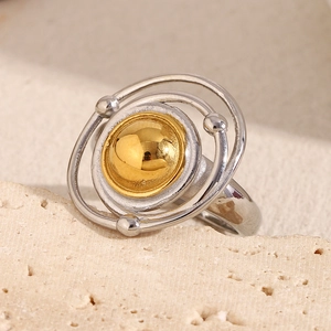 Detail of celestial planet ring featuring a gold sphere and two-tone silver orbits