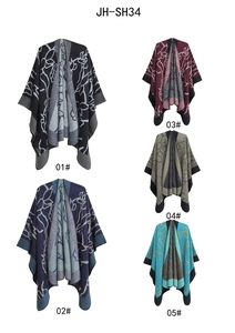 Multiple color options for knit jacquard ponchos featuring ink painting totem patterns