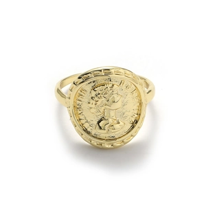 Macro detail of the vintage coin relief design on 18K gold orbital ring surface