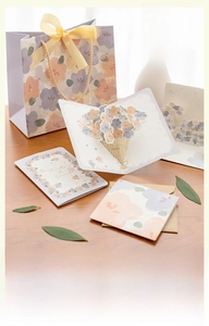 Detail of floral pop-up greeting card set with matching gift bag and ribbon handles