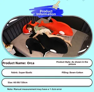 Detailed view of plush orca pillow available in red and black with size specifications