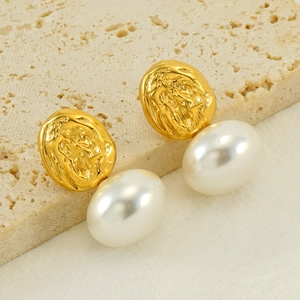 French vintage gold textured lava earrings with white baroque pearls on stone