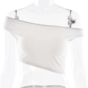 Close-up of white one-shoulder crop top with asymmetric hem and elastic fabric texture
