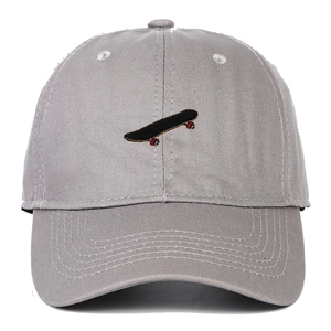 Close-up of grey cotton baseball cap featuring detailed skateboard embroidery and curved brim