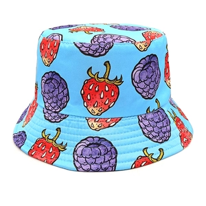 Sky blue reversible bucket hat with all-over red strawberry and purple berry print