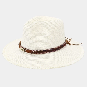 Detail of white straw fedora featuring a leather band with colorful beads and a gold feather