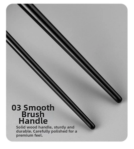 Detail of premium solid wood makeup brush handle with smooth black high-gloss finish